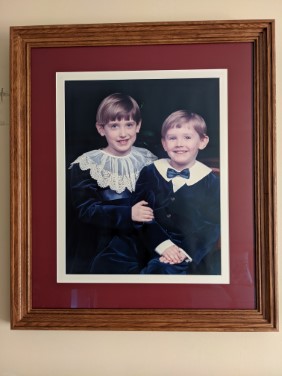 full screen photo of picture frame with photo of children